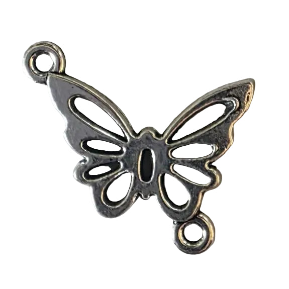 Silver butterfly charm on a white background