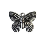 Silver butterfly-shaped charm on a light gray background