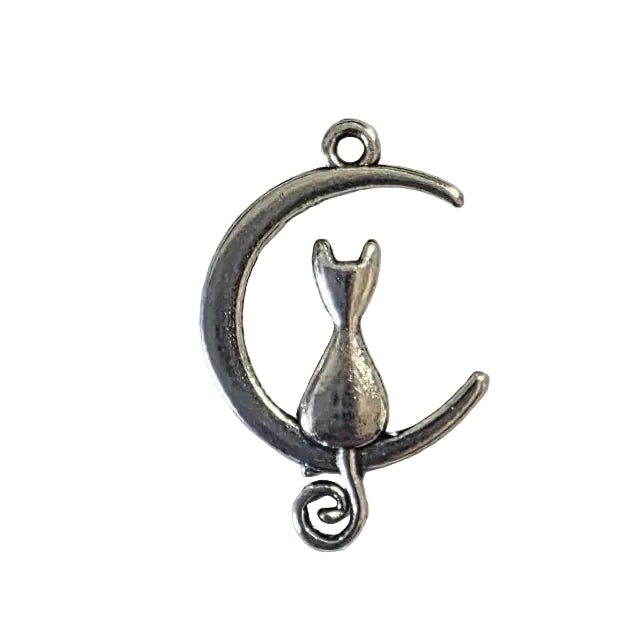 Small silver crescent moon charm with a cat in the middle on a light gray background