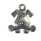Silver dog with bone charm on a gray  background