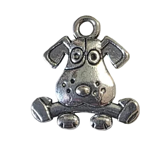 Silver dog with bone charm on a gray  background