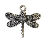 Silver dragonfly charm on a white background