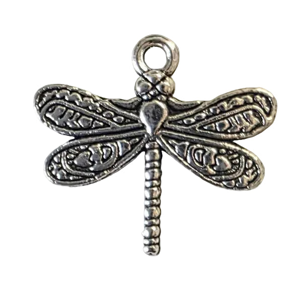 Silver dragonfly charm on a white background
