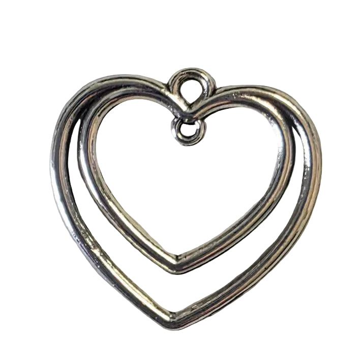 Silver heart-shaped pendant on a light gray background