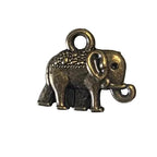 Small bronze-colored charm with a gemstone on a light gray background