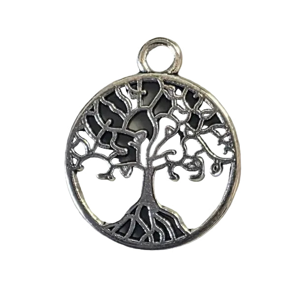 Silver tree of life pendant on a gray background