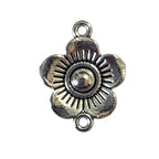 Silver flower-shaped pendant on a light gray background