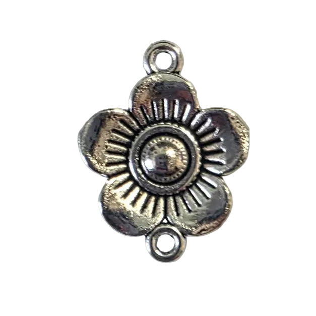 Silver flower-shaped pendant on a light gray background