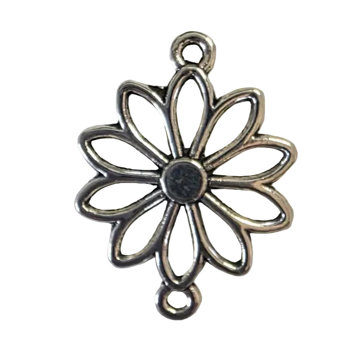 Silver floral pendant on a light gray background