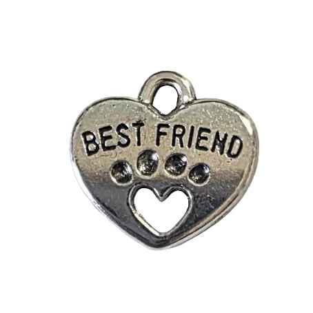 Silver heart-shaped pendant with "best friend" engraved text and paw print on a light gray background