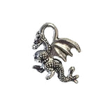 Small silver charm shaped like a horse on a light gray background