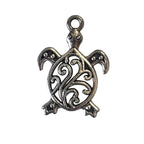Silver turtle pendant on a light gray background