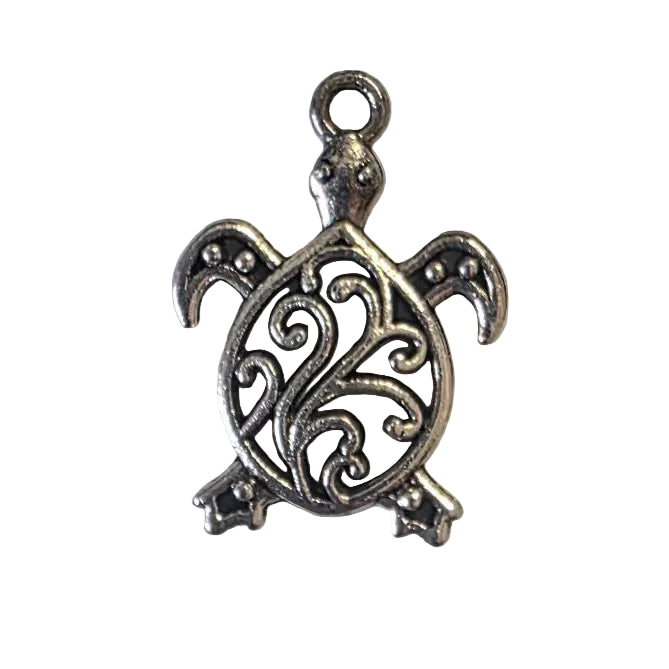 Silver turtle pendant on a light gray background